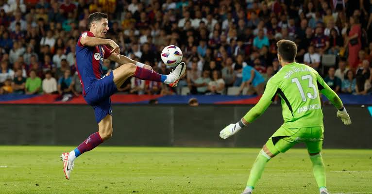 Lewandowski and  Cancelo strike as Barca  snatch 3-2 win over Celta