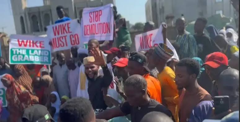 OAU students protest Wike’s building demolitions in FCT as minister visits campus